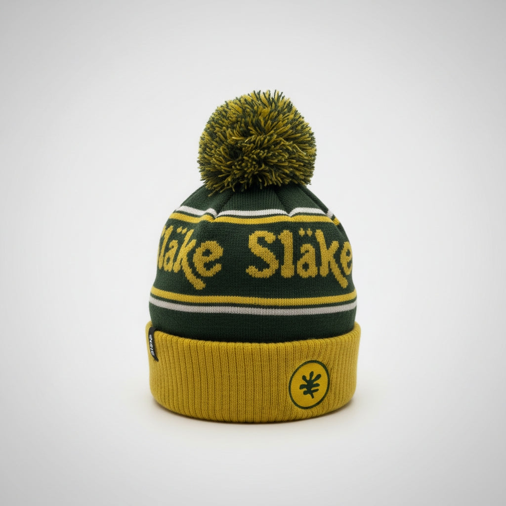 Släke pom mössa i grönt & gult